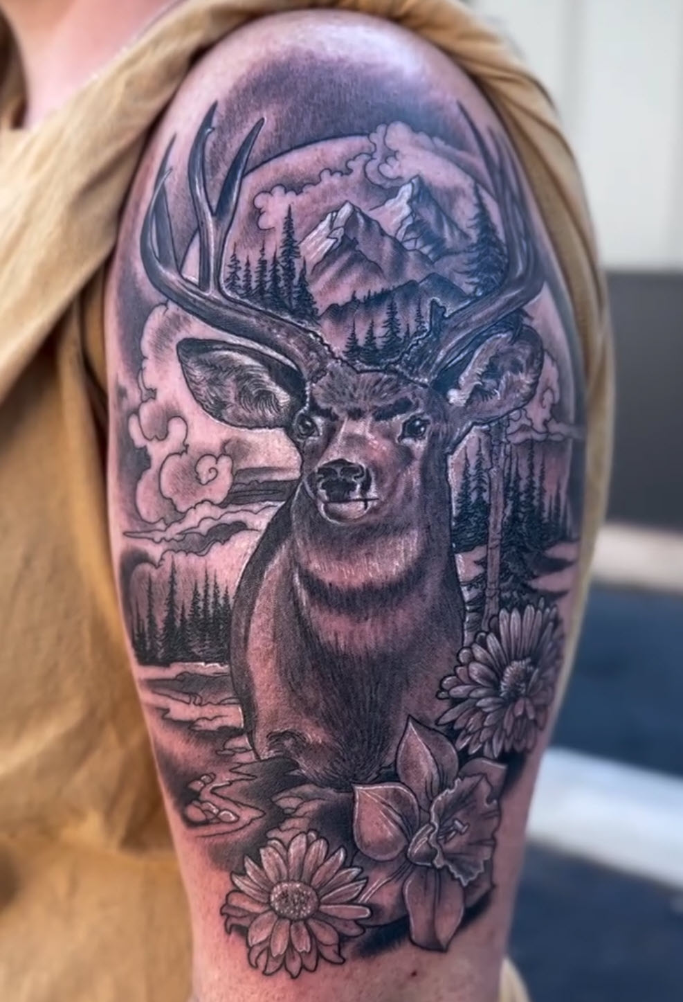 Deer with mountain landscape in black and grey